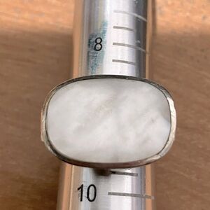 Gorgeously simple very large mother of pearl in bezel sterling silver setting.